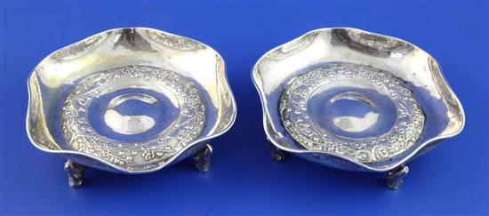 A pair of early 20th century Chinese silver shallow dishes, 11 oz.